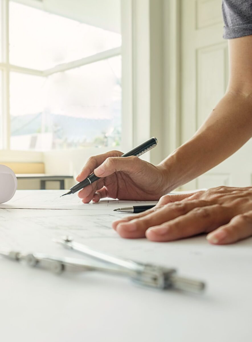 hands of engineer working on blueprint,construction concept. eng